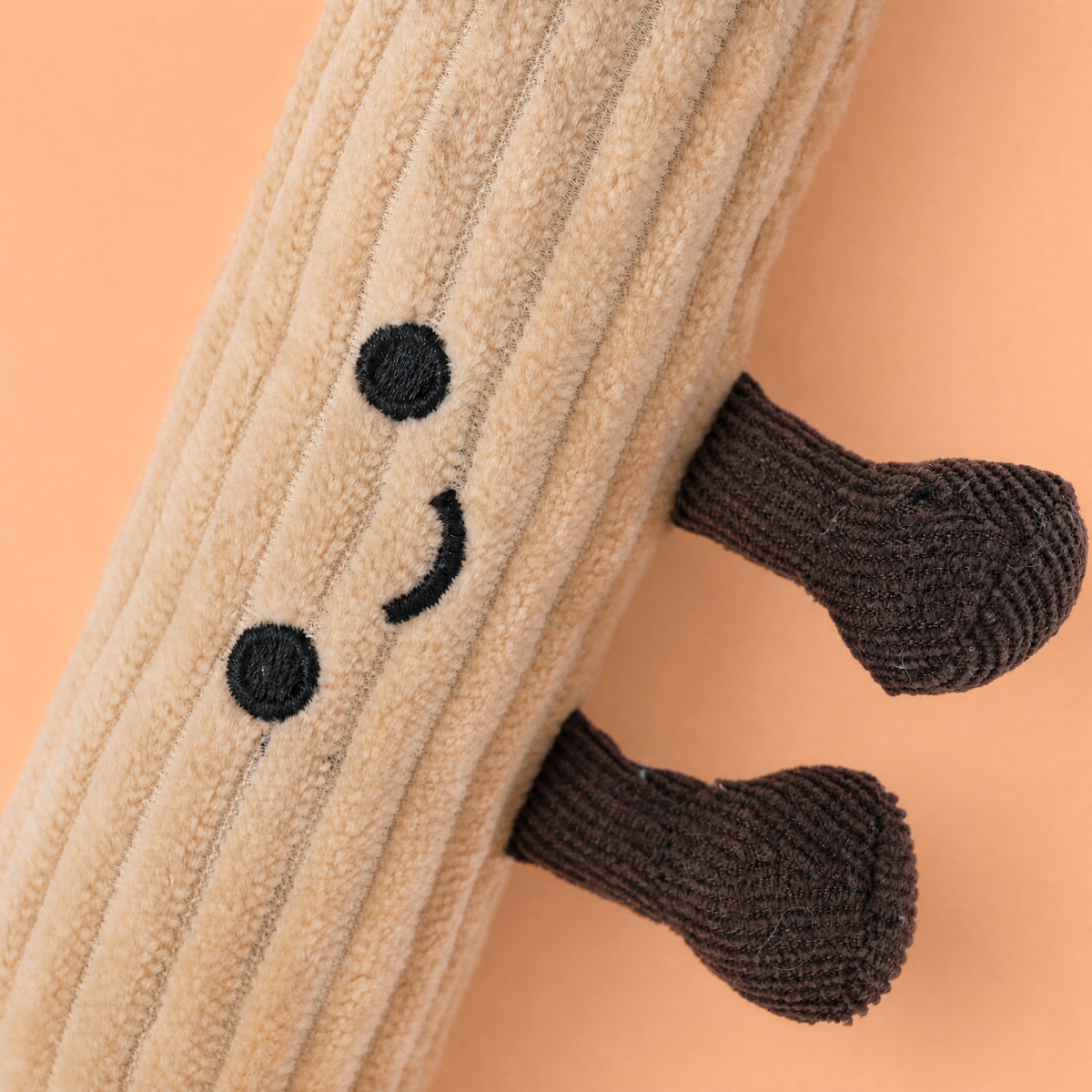 Churro plush bag charm with gold clip attachment