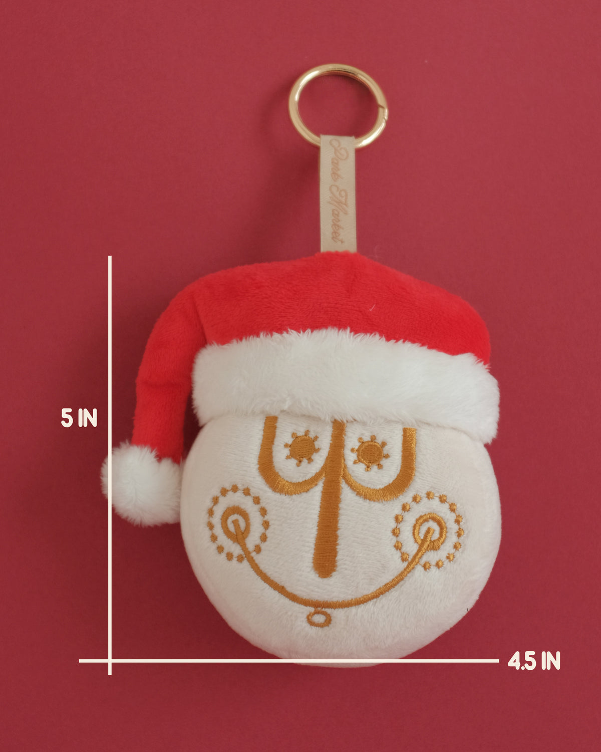 Clock face plush bag charm in a Santa hat with gold embroidery; measurement lines show 5 inches tall by 4.5 inches wide